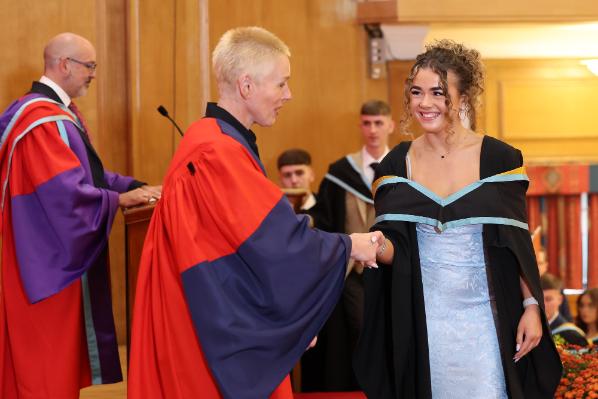 Graduates receiving their award